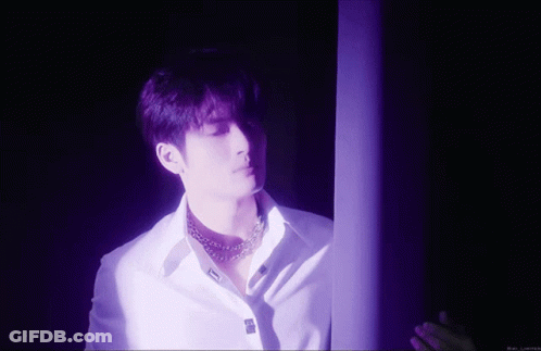 Man In White Shirt In Purple Room GIF
