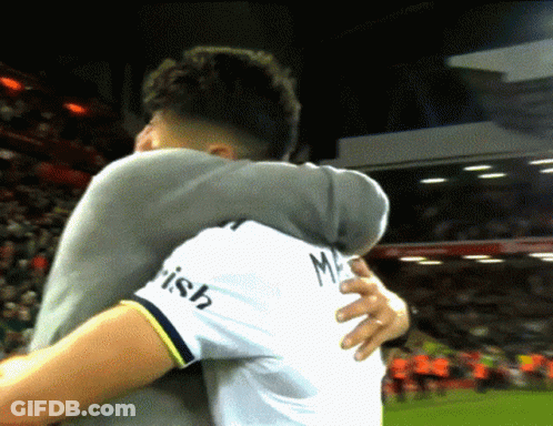 Man In White Shirt Irish Hugging Another GIF