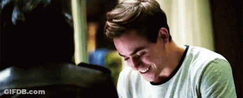Man In White Shirt Laughing Next To Another Man GIF