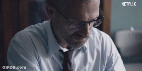 Man In White Shirt Looking In Mirror GIF