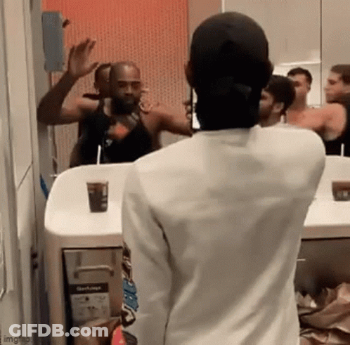 Man In White Shirt Looking In Mirror GIF