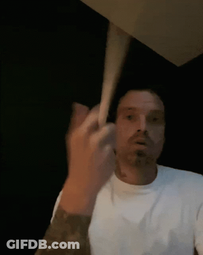 Man In White Shirt Making Face With Hand GIF