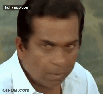 Man In White Shirt Making Funny Face Eyes Closed GIF