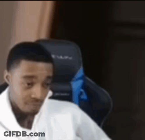 Man In White Shirt Making Funny Face In Gaming Chair GIF