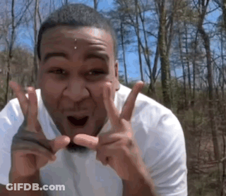 Man In White Shirt Making Peace Sign GIF