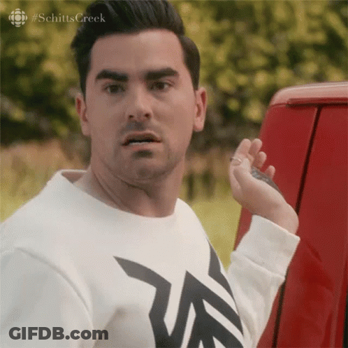 Man In White Shirt Next To Red Truck GIF