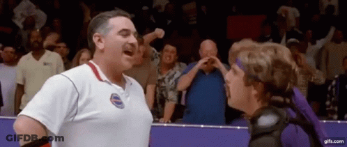 Man In White Shirt Next To Woman In Purple Headband GIF