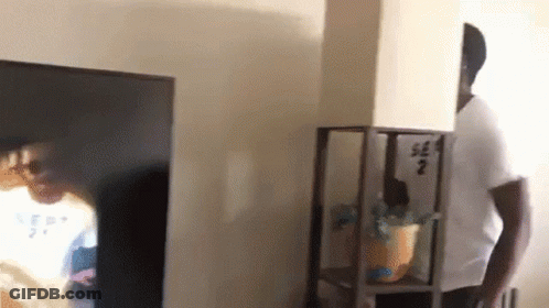 Man In White Shirt Number 2 In Front Of TV GIF