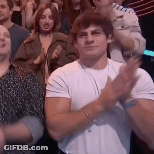 Man In White Shirt Number 52 In Front Of Clock Wall GIF