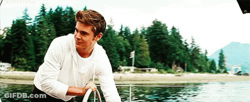 Man In White Shirt On Boat In Water GIF