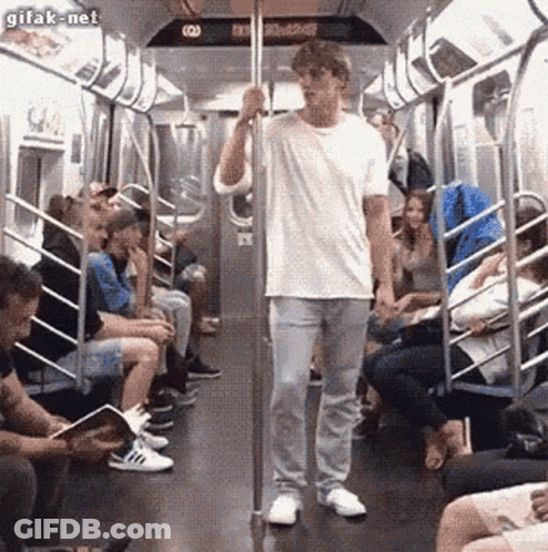 Man In White Shirt On Subway GIF