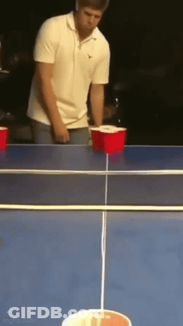 Man In White Shirt Playing Beer Pong GIF
