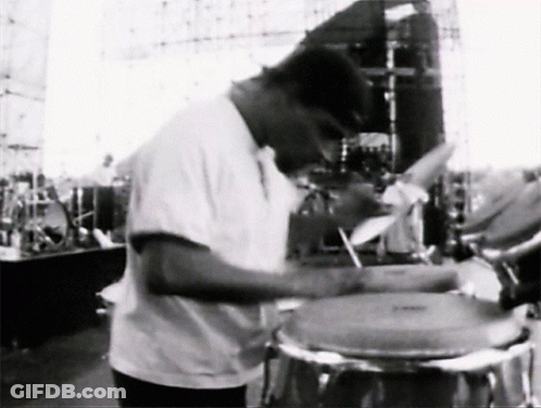 Man In White Shirt Playing Drums GIF