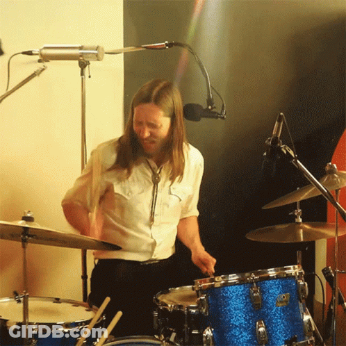 Man In White Shirt Playing Drums GIF
