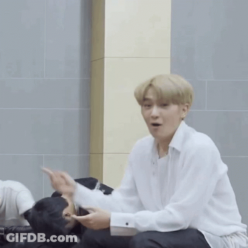 Man In White Shirt Pointing At Another Man GIF