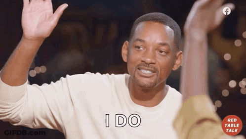 Man In White Shirt Raising Hand And Saying I Do GIF