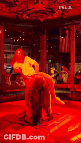 Man In White Shirt Riding Bull In Rodeo GIF