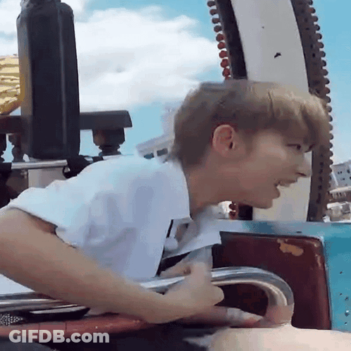 Man In White Shirt Riding Roller Coaster GIF