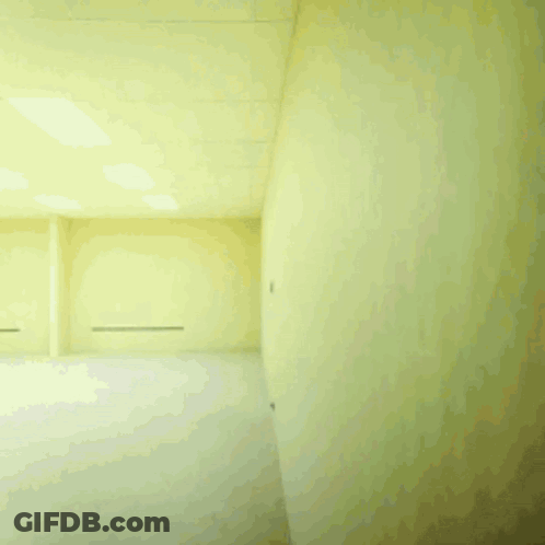 Man In White Shirt Running Through Furniture GIF