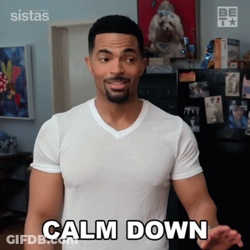 Man In White Shirt Saying Calm Down GIF