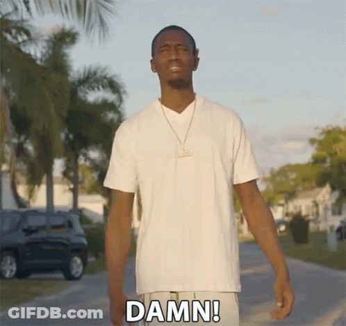 Man In White Shirt Saying Damn Walking Down Street GIF