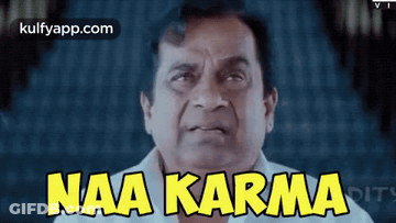 Man In White Shirt Saying Naa Karma Yellow GIF