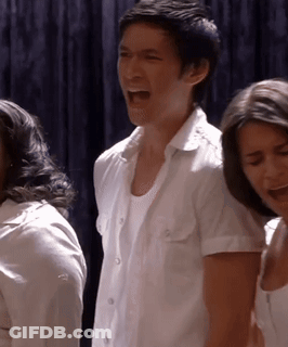 Man In White Shirt Screaming Beside Woman GIF