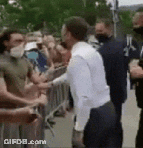 Man In White Shirt Shaking Hands GIF