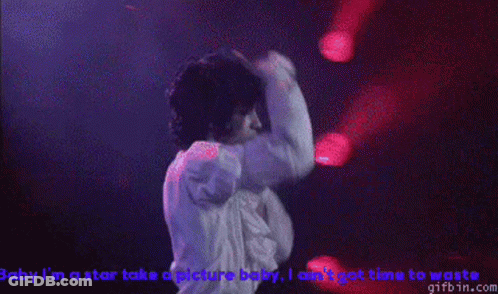 Man In White Shirt Singing Baby I'm A Star Take A Picture Baby GIF