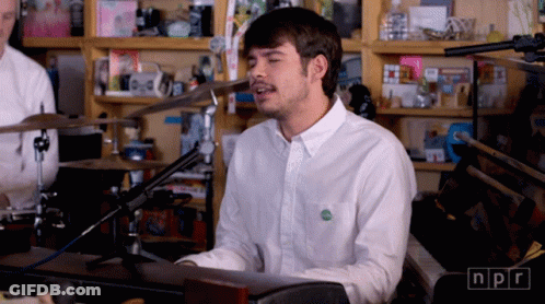 Man In White Shirt Singing Into Microphone NPR GIF