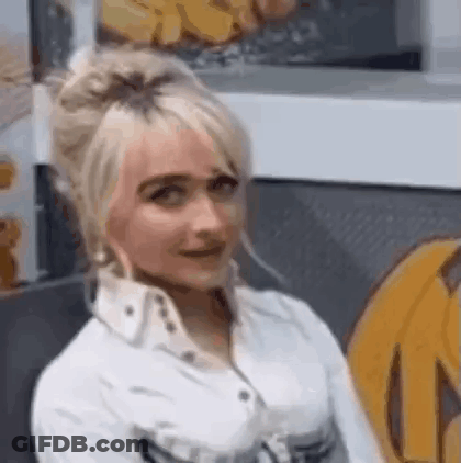Man In White Shirt Sitting Beside Woman In Blue Dress GIF