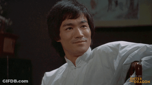 Man In White Shirt Sitting Enter The Dragon GIF