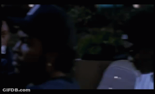Man In White Shirt Sitting In Car With Sign Saying Adam GIF