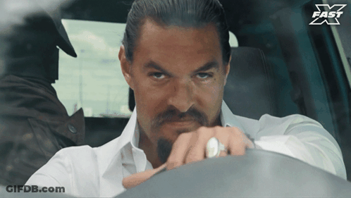 Man In White Shirt Sitting In Car With X Fast Logo GIF
