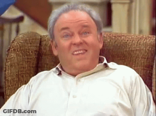 Man In White Shirt Sitting In Chair GIF