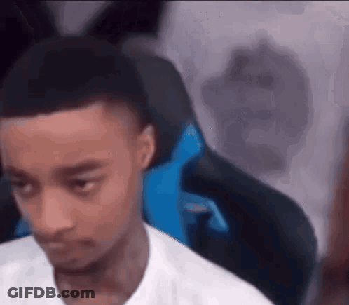 Man In White Shirt Sitting In Chair GIF