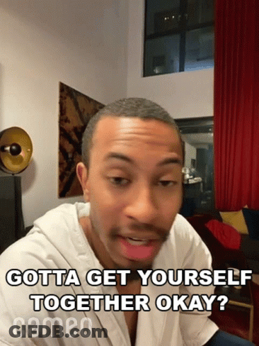 Man In White Shirt Sitting In Living Room Saying Gotta Get Yourself Together Okay GIF
