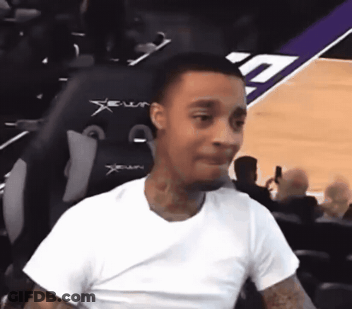 Man In White Shirt Sitting In Xenon Chair On Basketball Court GIF