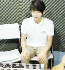 Man In White Shirt Sitting Next To Guitar GIF