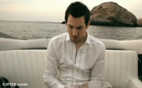 Man In White Shirt Sitting On Boat GIF
