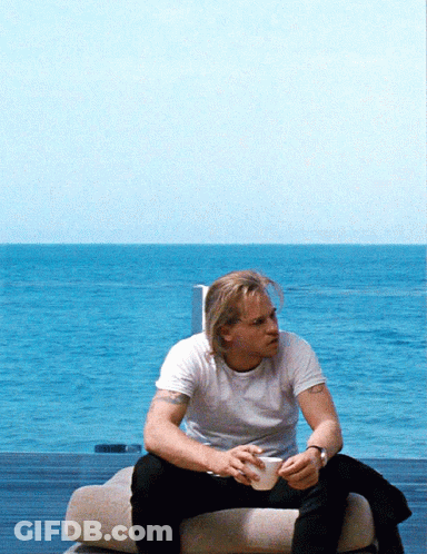 Man In White Shirt Sitting On Couch GIF