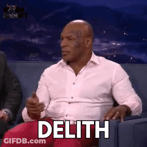 Man In White Shirt Sitting On Couch With Delith GIF