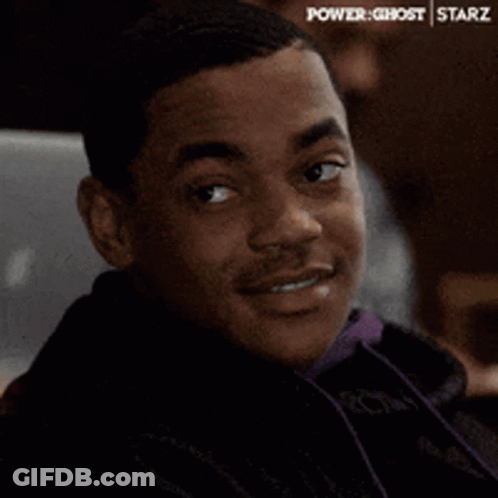 Man In White Shirt Sitting Saying Enter The Dragon GIF