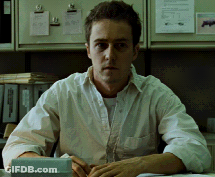 Man In White Shirt Sitting With Calculator GIF