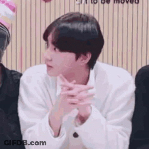 Man In White Shirt Sitting With Hands Folded GIF