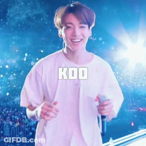 Man In White Shirt Smiling With Microphone GIF