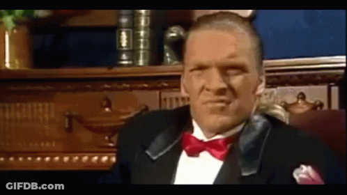 Man In White Shirt Smoking And Pointing GIF