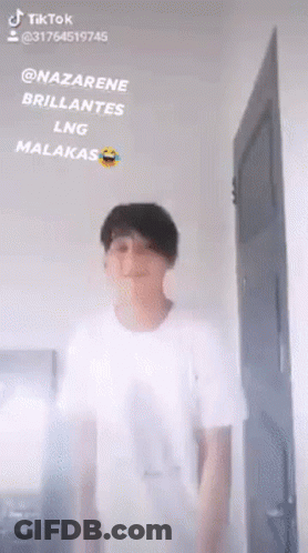 Man In White Shirt Standing Before Door Saying Nazarene Brillantes Lng Malakas GIF