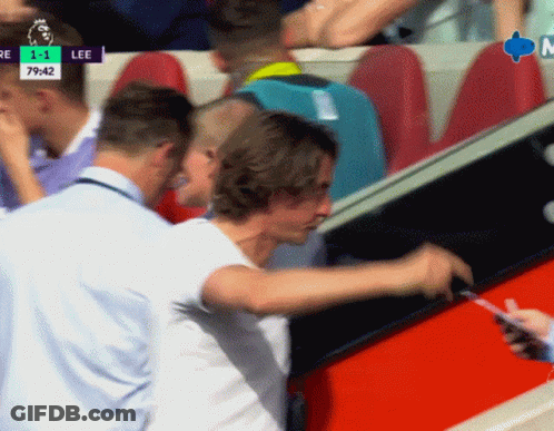 Man In White Shirt Standing Before Lee Screen GIF