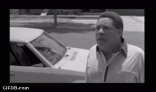 Man In White Shirt Standing By Car GIF